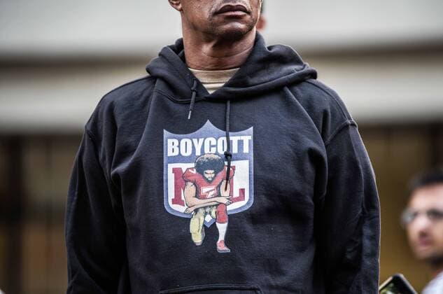 August 23, 2017 - New York City, New York, United States of America - Boycott NFL American Football Herren USA jersey. New Yorkers rallied behind now-unsigned NFL player Colin Kaepernick who has remained seated during the singing of the US National Anthem since 2016. Kaepernick has stated I am not going to stand up to show pride in a flag for a country that oppresses black people and people of color.Ã¢â‚¬Â Kaepernick exercised his free agency option with the San Francisco 49ers and remains unsigned, which some see as a sign of a blacklisting in the NFL. Calls against Verizon were also made due to its 130 million in advertising with the NFL. Hundreds Rally for Colin Kaepernick Outside NYC NFL Headquarters - ZUMAb160 79873260st Copyright: xSachellexBabbarx