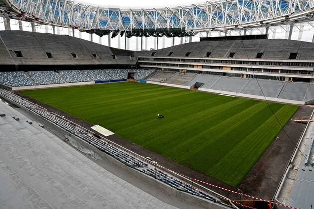 NIZHNY NOVGOROD, RUSSIA - AUGUST 26, 2017: A worker operates pitch maintenance machinery at Nizhny Novgorod Stadium, a venue for 2018 FIFA World Cup WM Weltmeisterschaft Fussball matches. Sergei Fadeichev TASS  TS05CF18