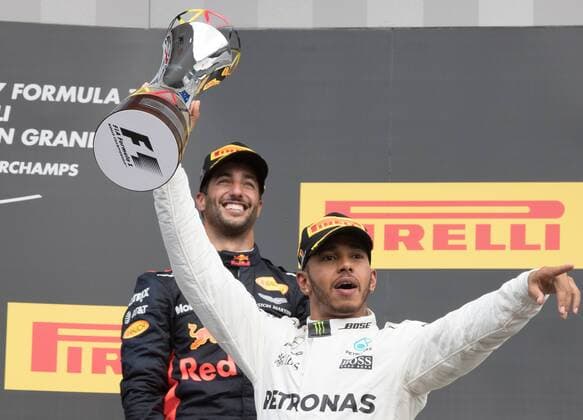 Red Bull s Australian driver Daniel Ricciardo and Mercedes British driver Lewis Hamilton celebrate on the podium after the Spa-Francorchamps Formula One Grand Prix of Belgium race, in Spa-Francorchamps, Sunday 27 August 2017. BENOITxDOPPAGNE  x05153375x