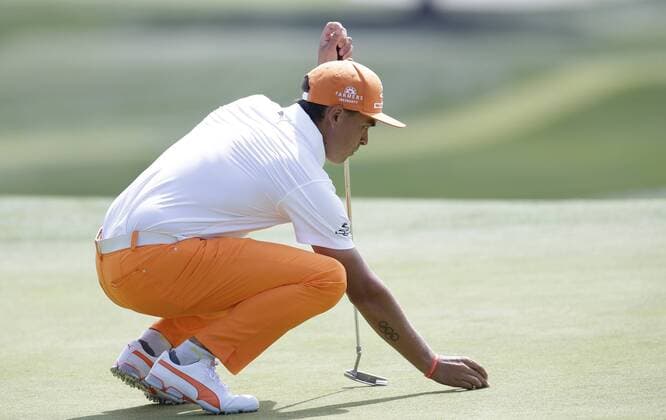 Rickie Fowler lines up a putt on the 9th hole in the final round of The Northern Trust golf championship at the Glen Oaks Club in Old Westbury, New York on August 27, 2017. Glen Oaks Club is hosting THE NORTHERN TRUST for the first time.  NYP20170827101 JOHNxANGELILLO