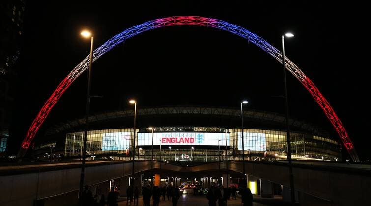 March 26th 2017, Wembley Stadium, London, England; World Cup 2018 Qualification football, England versus Lithuania; Wembley Stadium arch lit up in red, white and blue colours to in memory of those who died in the Westminster terror attacks as the fans leave the stadium xJohnxPatrickxFletcherx  ActionPlus11860888