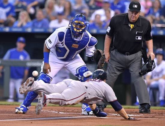 September 8, 2017 - Kansas City, MO, USA - The Minnesota Twins Brian Dozier tags up and dives in to score ahead of the throw to Kansas City Royals catcher Salvador Perez on a sacrifice fly by Eddie Rosario in the first inning at Kauffman Stadium in Kansas City, Mo., on Friday, Sept. 8, 2017. Minnesota at Kansas City - ZUMAm67_ 20170908_zaf_m67_050 Copyright: xJohnxSleezerx