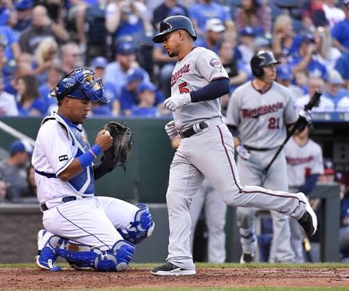 September 9, 2017 - Kansas City, MO, USA - The Minnesota Twins Eduardo Escobar crosses home plate in front of Kansas City Royals catcher Salvador Perez after Escobar s solo home run in the third inning at Kauffman Stadium in Kansas City, Mo., on Saturday, Sept. 9, 2017. Minnesota at Kansas City - ZUMAm67_ 20170909_zaf_m67_152 Copyright: xJohnxSleezerx