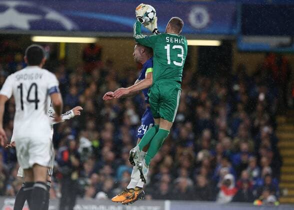 12th September 2017, Stamford Bridge, London, England; UEFA Champions League Group stage, Chelsea versus Qarabag FK; Ibrahim Sehic of Qarabag FK jumps over Gary Cahill, the Chelsea captain to catch the ball  ActionPlus11929402