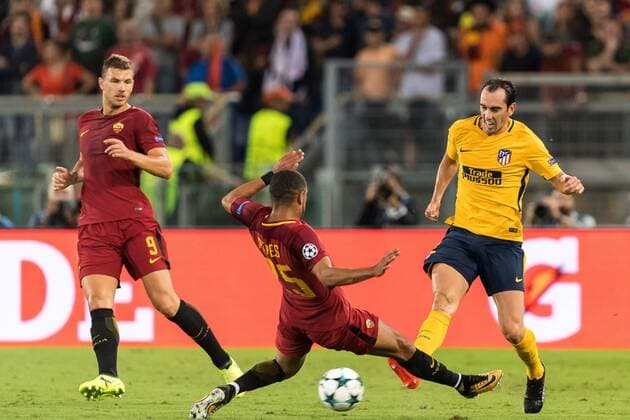 (L-R) Edin Dzeko of AS Roma, Bruno Peres of AS Roma, Diego Godin of Club Atletico de Madrid during the UEFA Champions League group C match match between AS Roma and Atletico Madrid on September 12, 2017 at the Stadio Olimpico in Rome, Italy. UEFA Champions League 2017 2018 xVIxVIxImagesx xGerritxvanxKeulenxIVx 8727656