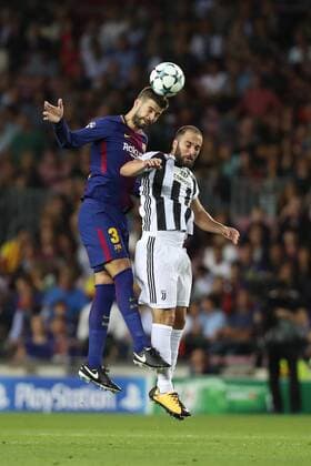 September 12, 2017 - Barcelona, Spain - Gerard Pique of FC Barcelona Barca heads the ball under pressure from Gonzalo Higuain of Juventus during the UEFA Champions League, Group D football match between FC Barcelona and Juventus FC on September 12, 2017 at Camp Nou stadium in Barcelona, Spain. Football - UEFA Champions League - FC Barcelona vs Juventus FC  - ZUMAb169 20170912_zaa_b169_007 Copyright: xManuelxBlondeau Aop.Pressx