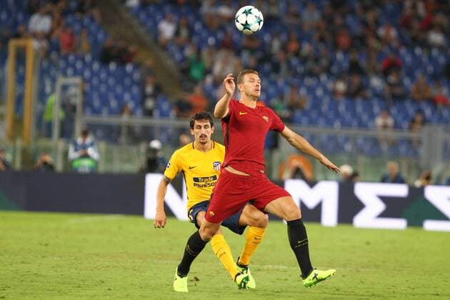 12th September 2017, Stadio Olimpic, Rome, Italy; UEFA Champions League between AS Roma versus Club Atletico de Madrid Edin Dzeko under pressure from Savic ; the game ended on a 0-0 draw  ActionPlus11929544