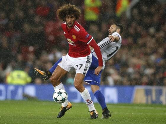 Marouane Fellaini of Manchester United ManU (L) is tackles Renato Steffen of Basel during the Champions League Group A match at the Old Trafford Stadium, Manchester. Picture date: September 12th 2017. Picture credit should read: Andrew Yates Sportimage EDITORIAL USE ONLY. No use with unauthorised audio, video, data, fixture lists, club league logos or live services. Online in-match use limited to 120 images, no video emulation. No use in betting, games or single club league player publications.