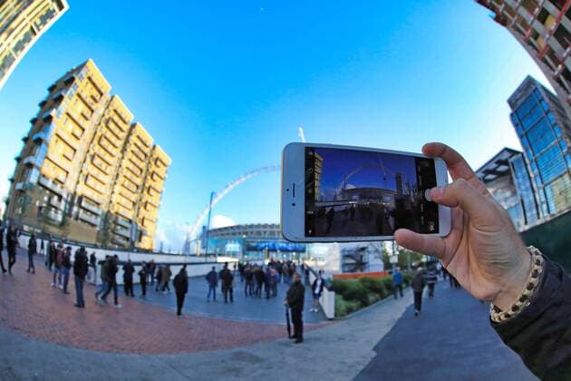 13th September 2017, Wembley Stadium, London, England; Champions League Group stage, Tottenham Hotspur versus Borussia Dortmund; A fan takes a photo of Wembley Stadium on his phone  ActionPlus11929737
