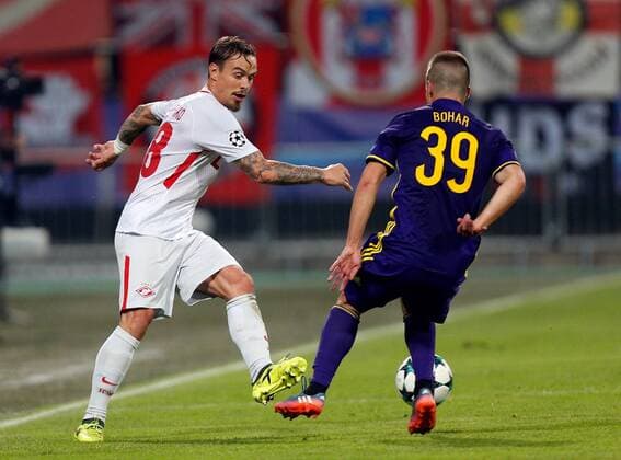 SOCCER - CL, Maribor vs Spartak MARIBOR,SLOVENIA,13.SEP.17 - UEFA Champions League, group stage, NK Maribor vs FK Spartak Moscow. Image shows Andrei Eschenko (Spartak) and Damjan Bohar (Maribor). GEPAxpictures xDavidxRodriguez