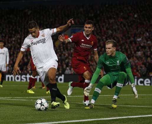 Wissam Ben Yedder of Sevilla draws out Loris Karius of Liverpool off his line lduring the Champions League Group E match at the Anfield Stadium, Liverpool. Picture date 13th September 2017. Picture credit should read: Simon Bellis Sportimage EDITORIAL USE ONLY. No use with unauthorised audio, video, data, fixture lists, club league logos or live services. Online in-match use limited to 120 images, no video emulation. No use in betting, games or single club league player publications.