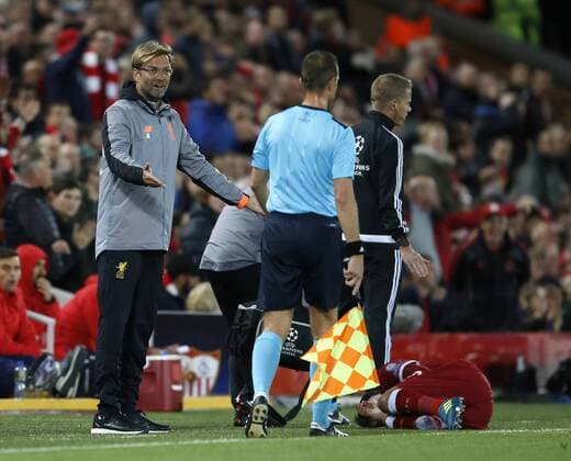 Jurgen Klopp manager of Liverpool complains to the lineman following a tackle on Roberto Firmino of Liverpool during the Champions League Group E match at the Anfield Stadium, Liverpool. Picture date 13th September 2017. Picture credit should read: Simon Bellis Sportimage EDITORIAL USE ONLY. No use with unauthorised audio, video, data, fixture lists, club league logos or live services. Online in-match use limited to 120 images, no video emulation. No use in betting, games or single club league player publications.