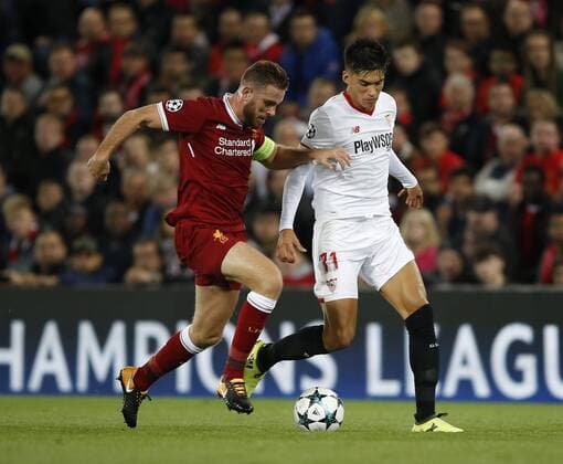 Jordan Henderson of Liverpool tackles Joaquin Correa of Sevilla during the Champions League Group E match at the Anfield Stadium, Liverpool. Picture date 13th September 2017. Picture credit should read: Simon Bellis Sportimage EDITORIAL USE ONLY. No use with unauthorised audio, video, data, fixture lists, club league logos or live services. Online in-match use limited to 120 images, no video emulation. No use in betting, games or single club league player publications.