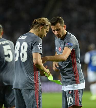 Caner Erkin and Oguzhan Ozyakup of Besiktas during the UEFA Champions League match between Porto and Besiktas at Estadio do Dragao Stadium in Porto , Portugal on September 13 , 2017. 
