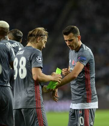 Caner Erkin and Oguzhan Ozyakup of Besiktas during the UEFA Champions League match between Porto and Besiktas at Estadio do Dragao Stadium in Porto , Portugal on September 13 , 2017. 