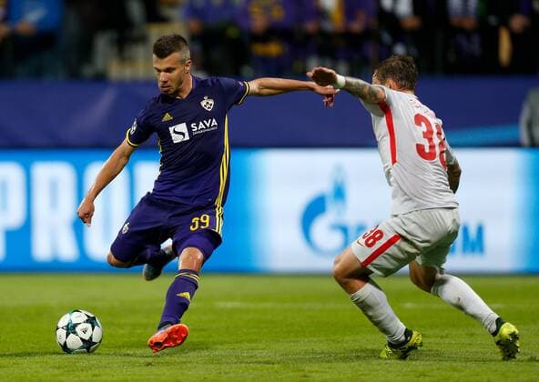 SOCCER - CL, Maribor vs Spartak MARIBOR,SLOVENIA,13.SEP.17 - UEFA Champions League, group stage, NK Maribor vs FK Spartak Moscow. Image shows Damjan Bohar (Maribor) scoring a goal against Andrei Eschenko (Spartak). GEPAxpictures xDavidxRodriguez