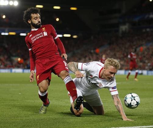Mohamed Salah of Liverpool tussles with Simon Kjaer of Sevilla during the Champions League Group E match at the Anfield Stadium, Liverpool. Picture date 13th September 2017. Picture credit should read: Simon Bellis Sportimage EDITORIAL USE ONLY. No use with unauthorised audio, video, data, fixture lists, club league logos or live services. Online in-match use limited to 120 images, no video emulation. No use in betting, games or single club league player publications.