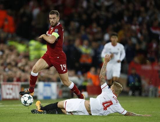 Jordan Henderson of Liverpool tackled by Simon Kjaer of Sevilla during the Champions League Group E match at the Anfield Stadium, Liverpool. Picture date 13th September 2017. Picture credit should read: Simon Bellis Sportimage EDITORIAL USE ONLY. No use with unauthorised audio, video, data, fixture lists, club league logos or live services. Online in-match use limited to 120 images, no video emulation. No use in betting, games or single club league player publications.