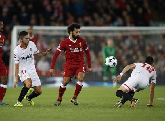 Mohamed Salah of Liverpool tussles with Sergio Escudero of Sevilla during the Champions League Group E match at the Anfield Stadium, Liverpool. Picture date 13th September 2017. Picture credit should read: Simon Bellis Sportimage EDITORIAL USE ONLY. No use with unauthorised audio, video, data, fixture lists, club league logos or live services. Online in-match use limited to 120 images, no video emulation. No use in betting, games or single club league player publications.