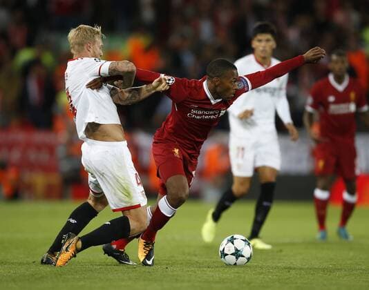 Daniel Sturridge of Liverpool in action with Simon Kjaer of Sevilla during the Champions League Group E match at the Anfield Stadium, Liverpool. Picture date 13th September 2017. Picture credit should read: Simon Bellis Sportimage EDITORIAL USE ONLY. No use with unauthorised audio, video, data, fixture lists, club league logos or live services. Online in-match use limited to 120 images, no video emulation. No use in betting, games or single club league player publications.