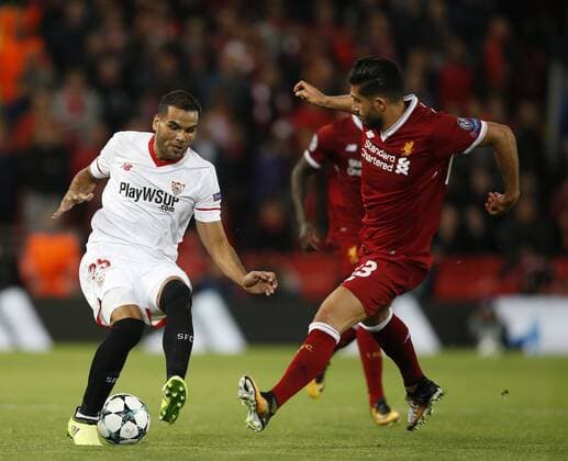 Gabriel Mercado of Sevilla challenged by Emre Can of Liverpool during the Champions League Group E match at the Anfield Stadium, Liverpool. Picture date 13th September 2017. Picture credit should read: Simon Bellis Sportimage EDITORIAL USE ONLY. No use with unauthorised audio, video, data, fixture lists, club league logos or live services. Online in-match use limited to 120 images, no video emulation. No use in betting, games or single club league player publications.