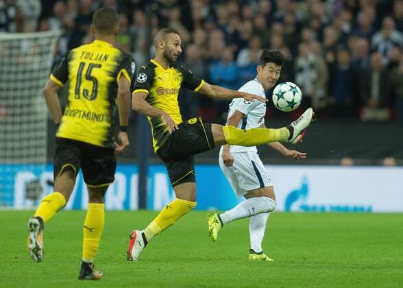 Ömer Toprak of Borussia Dortmund clears the ball from Son Heung-Min of Tottenham Hotspur during the UEFA Champions League group stage match between Tottenham Hotspur and Borussia Dortmund at Wembley Stadium, London, England on 13 September 2017. Copyright: xVincexMignottx 16640061