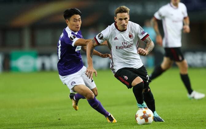 SOCCER - EL, Austria vs Milano VIENNA,AUSTRIA,14.SEP.17 - SOCCER - UEFA Europa League, group stage, FK Austria Wien VS AC Milano. Image shows Jinhyun Lee (A.Wien) and Lucas Biglia (Milano). GEPAxpictures xPhilippxBrem