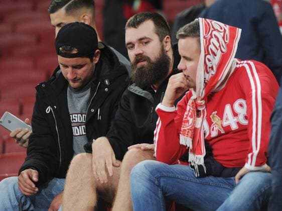 Football - 2017 2018 Europa League - Group H: Arsenal vs. FC Koln Koln fans sit in the stadium after hearing the game has been delayed by one hour, at The Emirates. COLORSPORT ANDREW COWIE 