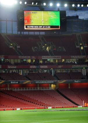 Football - 2017 2018 Europa League - Group H: Arsenal vs. FC Koln The scoreboard informs the few people the game has been delayed by one hour to an empty stadium, at The Emirates. COLORSPORT ANDREW COWIE 