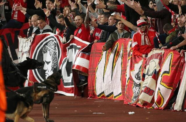 14th September 2017, Emirates Stadium, London, England; UEFA Europa League Group stage, Arsenal versus FC Cologne; FC Koln fans chanting before kick off, as Police dogs control  ActionPlus11930009