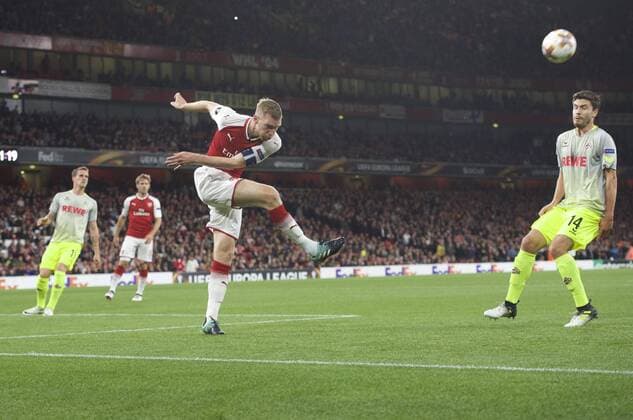 Arsenal v FC Cologne UEFA Champions League Per Mertesacker of Arsenal kicks the ball clear of Jonas Hector of FC Cologne during the UEFA Champions League match at the Emirates Stadium, London Content Not Available For UK Newspapers Copyright: xAlanxStanfordx FIL-10666-0026