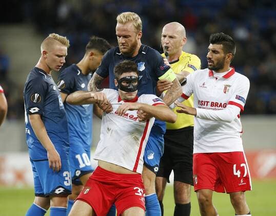 Kevin Vogt Hoffenh helps Nikola Vukcevic Braga on The Legs left Pavel Kaderabek Hoffenh right Referees Bobby Madden SCO and Ricardo Esgaio Braga TSG 1899 Hoffenheim Sporting Braga Sinsheim ger 14 09 2017 Europe League 2017 2018