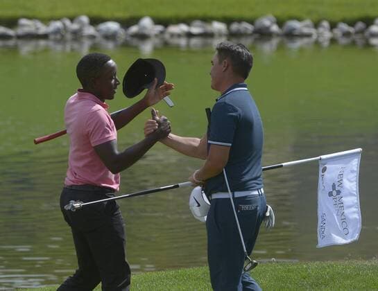 September 14, 2017 - U.S. - SPORTS -- Nyasha Mauchaza, left, congratulates Tyler Torano on his win of the New Mexico Open golf tournament at the Sandia Golf Course on Thursday, September 14, 2017. Sports News - September 14, 2017 - ZUMAab1_ 20170914_zaf_ab1_017 Copyright: xGregxSorberx