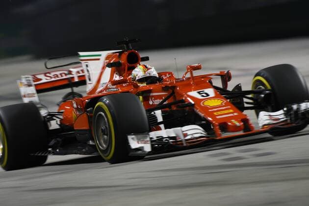(170915) -- SINGAPORE, Sept. 15, 2017 -- Ferrari s German driver Sebastian Vettel drives during the first practice session of the Formula One Singapore Grand Prix in Singapore on Sept. 15, 2017. ) (SP)SINGAPORE-FORMULA ONE-SINGAPORE GRAND PRIX-PRACTICE ThenxChihxWey 