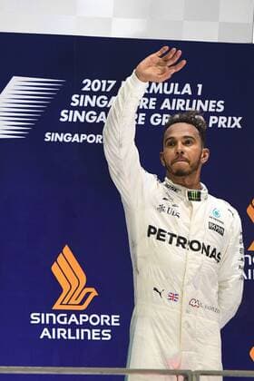 (170917) -- SINGAPORE, Sept. 17, 2017 -- Mercedes British driver Lewis Hamilton celebrates on the podium after winning the Formula One Singapore Grand Prix in Singapore on Sept. 17, 2017. ) (wll) (SP)SINGAPORE-FORMULA ONE-SINGAPORE GRAND PRIX ThenxChihxWey 