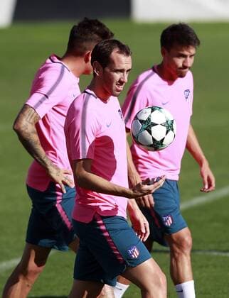 Atletico de Madrid s Diego Godin (l) and Nico Gaitan during training session. September 26,2017.  (2017092626)