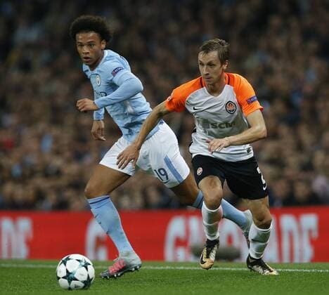 Leroy Sane of Manchester City tussles with Bohdan Butko of Shaktar Donetsk during the Champions League Group F match at the Emirates Stadium, Manchester. Picture date: September 26th 2017. Picture credit should read: Andrew Yates Sportimage EDITORIAL USE ONLY. No use with unauthorised audio, video, data, fixture lists, club league logos or live services. Online in-match use limited to 120 images, no video emulation. No use in betting, games or single club league player publications.