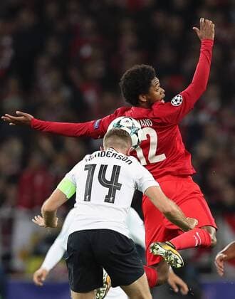 MOSCOW, RUSSIA - SEPTEMBER 26, 2017: Spartak Moscow s Luiz Adriano (back) and Liverpool s Jordan Henderson jump to head the ball in their 2017 18 UEFA Champions League Group E Round 2 football match at Otkrytie Arena Stadium. Artyom Korotayev TASS  TS061FD2