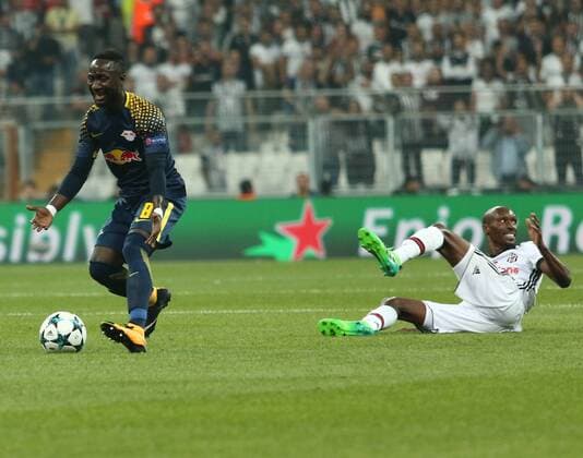Atiba Hutchinson of Besiktas and Naby Keita 8 of RB Leipzig during the UEFA Champions League Group G match between Besiktas and RB Leipzig at Vodafone Park in Istanbul , Turkey on September 26 , 2017 . 