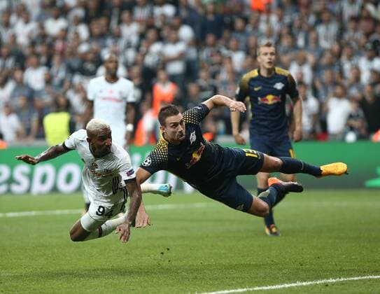 Anderson Talisca of Besiktas and Stefan Ilsanker 13 of RB Leipzig during the UEFA Champions League Group G match between Besiktas and RB Leipzig at Vodafone Park in Istanbul , Turkey on September 26 , 2017 . 