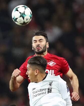 MOSCOW, RUSSIA - SEPTEMBER 26, 2017: Liverpool s Roberto Firmino (front) and Spartak Moscow s Salvatore Bocchetti jump to head the ball in their 2017 18 UEFA Champions League Group E Round 2 football match at Otkrytie Arena Stadium. The game ended in a 1-1 draw. Artyom Korotayev TASS  TS062059