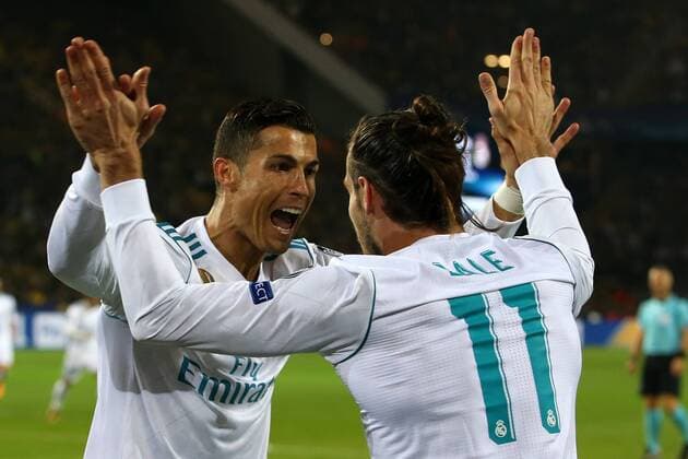 (170927) -- DORTMUND, Sept. 27, 2017 -- Cristiano Ronaldo (L) of Real Madrid celebrates with teammate Gareth Bale during the UEFA Champions League group H match against Borussia Dortmund at Signal Iduna Park on Sept. 26, 2017 in Dortmund, Germany. Real Madrid won 3-1. ) (SP)GERMANY-DORTMUND-CHAMPIONS LEAGUE-DORTMUND-MADRID JoachimxBywaletz 