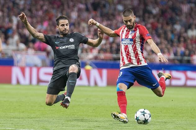 Atletico de Madrid s Yannick Carrasco and Chelsea s Cesc Fabregas during UEFA Champions League match between Atletico de Madrid and Chelsea at Wanda Metropolitano in Madrid, Spain September 27, 2017.  (20170927017)