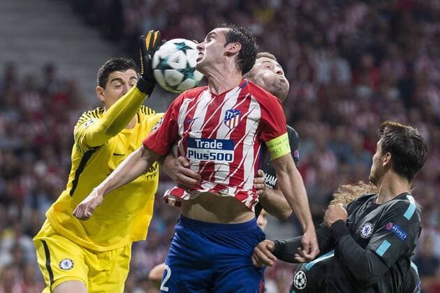 Atletico de Madrid s Diego Godin and Chelsea s Thibaut Courtois during UEFA Champions League match between Atletico de Madrid and Chelsea at Wanda Metropolitano in Madrid, Spain September 27, 2017.  (20170927018)
