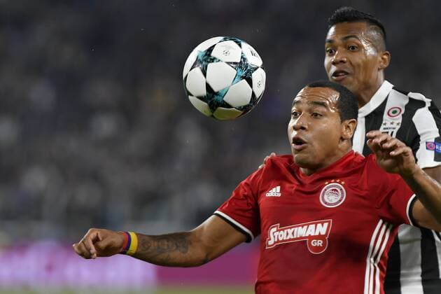 27th September 2017, Allianz Stadium, Turin, Italy; UEFA Champions League, Juventus versus Olympiacos; Felipe Pardo shields the high ball from Alex Sandro  ActionPlus11934748