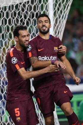 September 27, 2017 - Lisbon, Portugal - Barcelona s Uruguayan forward Luis Suarez (R ) celebrates with Barcelona s Spanish midfielder Sergio Busquets after scoring a goal during the UEFA Champions League football match Sporting vs Barcelona at the Alvalade stadium in Lisbon, Portugal on September 27, 2017. Photo: Sporting v Barcelona - UEFA Champions League  - ZUMAn230 20170927_zaa_n230_355 Copyright: xPedroxFiuzax
