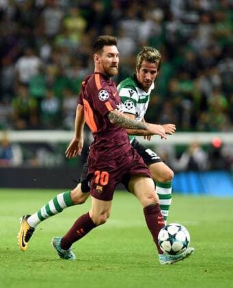 (170928) -- LISBON, Sept. 28, 2017 -- Barcelona s Lionel Messi (L) vies with Sporting s Fabio Coentrao during the UEFA Champions League group D match between Sporting CP and FC Barcelona Barca in Lisbon, Portugal, on Sept. 27, 2017. Barcelona won 1-0. ) (SP)PORTUGAL-LISBON-FOOTBALL-CHAMPIONS LEAGUE-BARCELONA-SPORTING ZhangxLiyun 
