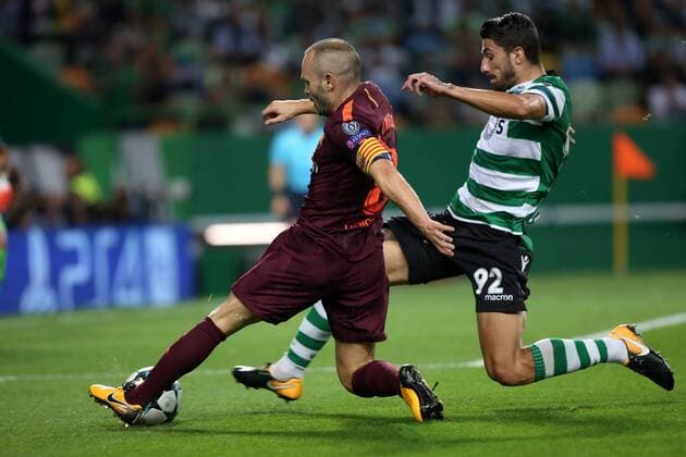 September 27, 2017 - Lisbon, Portugal - Barcelona s Spanish midfielder Andres Iniesta vies with Sporting s defender Cristiano Piccini from Italy during the UEFA Champions League football match Sporting vs Barcelona at the Alvalade stadium in Lisbon, Portugal on September 27, 2017. Photo: UEFA Champions League football match Sporting vs Barcelona - ZUMAf123 80280725st Copyright: xPedroxFiuzax