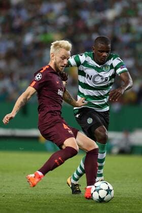 September 27, 2017 - Lisbon, Portugal - Barcelona s Croatian midfielder Ivan Rakitic vies with Sporting s midfielder William Carvalho from Portugal during the UEFA Champions League football match Sporting vs Barcelona at the Alvalade stadium in Lisbon, Portugal on September 27, 2017. Photo: UEFA Champions League football match Sporting vs Barcelona - ZUMAf123 80280726st Copyright: xPedroxFiuzax