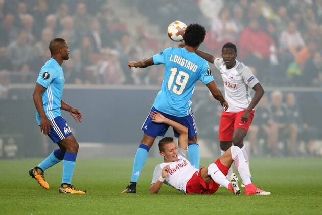 SOCCER - EL, RBS vs Marseille SALZBURG,AUSTRIA,28.SEP.17 - SOCCER - UEFA Europa League, group stage, Red Bull Salzburg vs Olympique Marseille. Image shows Patrice Evra, Luiz Gustavo (Marseille), Hannes Wolf and Jerome Onguene (RBS). GEPAxpictures xMathiasxMandl